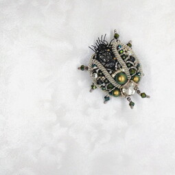 Iridescent beetle's attak