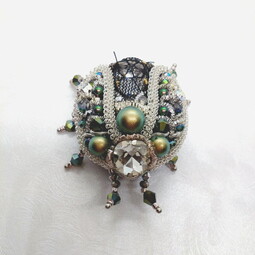 Iridescent beetle's attak