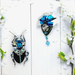 Black-blue bug and flower brooches