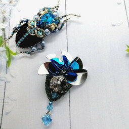 Black-blue bug and flower brooches