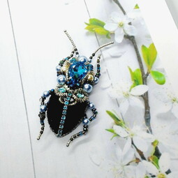 Black-blue bug and flower brooches