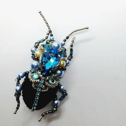 Black-blue bug and flower brooches